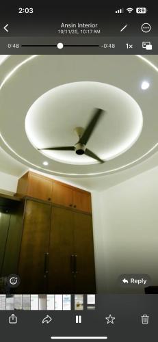 a clock on the ceiling of a room at JDs elite in Trivandrum