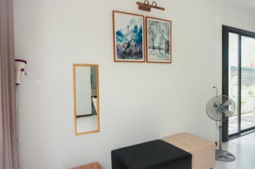 a white room with two mirrors and a fan at Luxury Mi-a Villa LaGi 4pn, huge salted pool, outdoor bbq and kara, up to 20 in Lagi