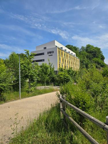 a building with a fence in front of a road at DWO San Sebastián in San Sebastián