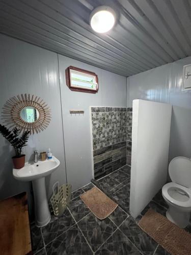 a bathroom with a sink and a toilet at Kai Kabana Chill in HUH