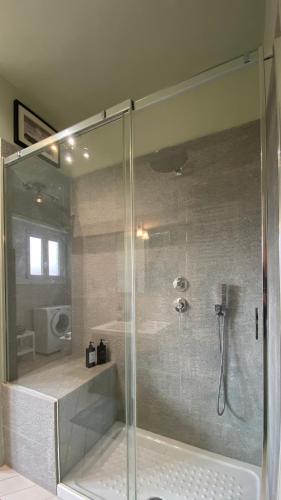 a shower with a glass door in a bathroom at Collegno Centro - Il Bumbunin... in Collegno