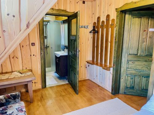 a bathroom with a sink and a toilet in a room at Agroturystyka Na Górze - Obrocz 116A in Obrocz