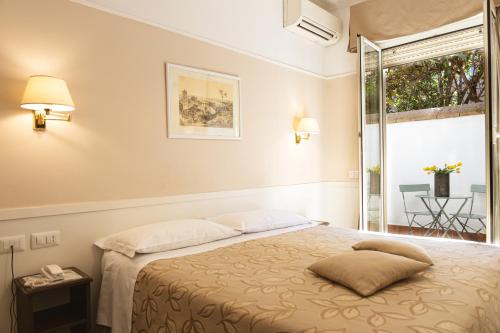 מיטה או מיטות בחדר ב-Hotel Modigliani