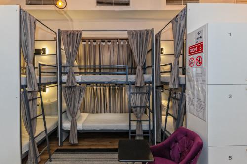 a couple of bunk beds in a room at TURQUOISE Hostel in Bucharest
