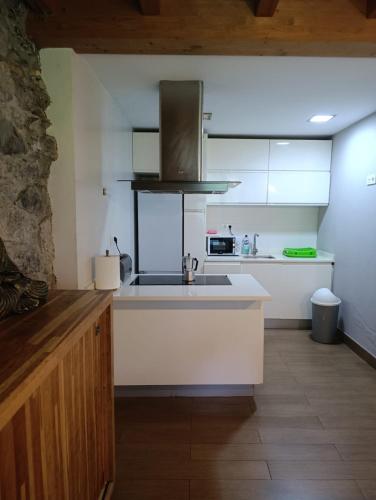 a kitchen with a sink and a counter top at Casa con encanto in Arredondo
