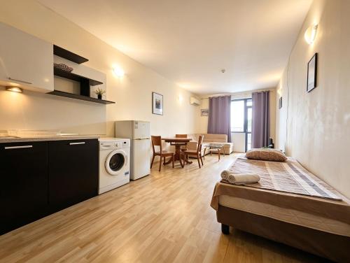 a small apartment with a kitchen and a living room at Europroperties Yalta Apartments in Golden Sands