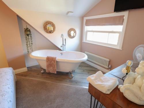 a bathroom with a claw foot tub in a attic at 4 Eve Street in Louth