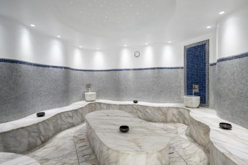 a large bathroom with a large marble table in it at Naveh Tamar - Mehadrin Kosher suitable for Ultra-Orthodox guests in Acre