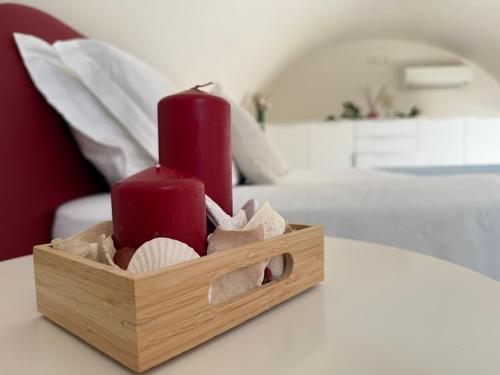a wooden box with two candles on a bed at Casa Pont1 Historic Pontone near Amalfi & Ravello in Scala
