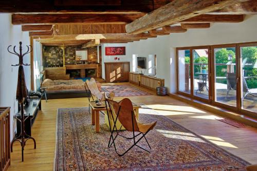 a large living room with a couch and a fireplace at Zalanka in Zalaköveskút