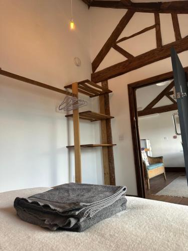 a room with a bunk bed with a open door at The Upper Nest in Hereford