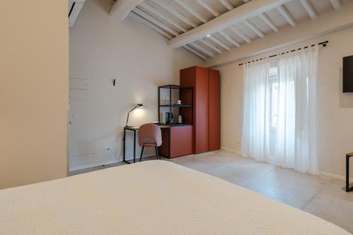 Katil atau katil-katil dalam bilik di AmiRooms Affittacamere