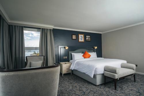 a hotel room with a bed and a window at The Lochalsh Hotel - Isle of Skye in Kyle of Lochalsh