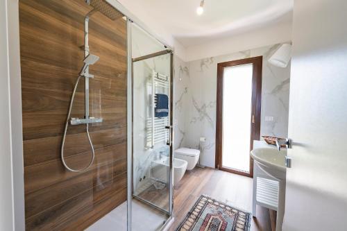 a bathroom with a shower and a toilet at GuestHost - Barni House in Montesilvano