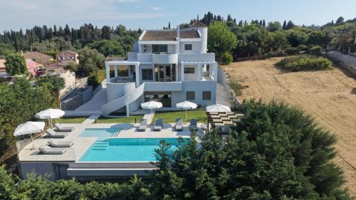 an aerial view of a house with a swimming pool at Casa Grande Private Luxury Villa in Alykes Potamou