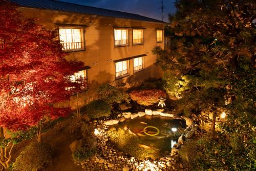 an overhead view of a building with a garden at Ryokan Ichinomatsu in Hakodate