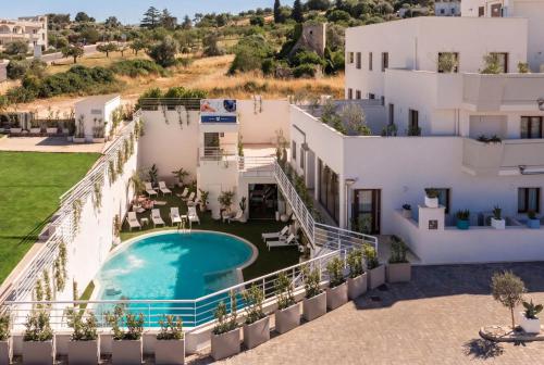 an aerial view of a villa with a swimming pool at ARBORIS BELLI Hotel in Alberobello