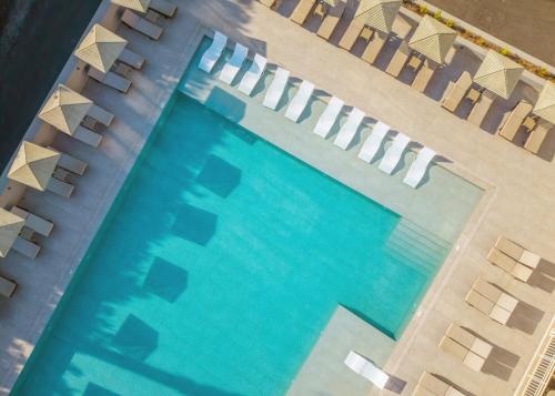 an overhead view of a swimming pool with chairs at Marilena Hotel in Amoudara Herakliou