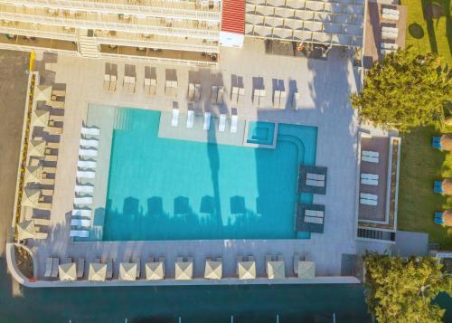 an overhead view of a large swimming pool with chairs at Marilena Hotel in Amoudara Herakliou