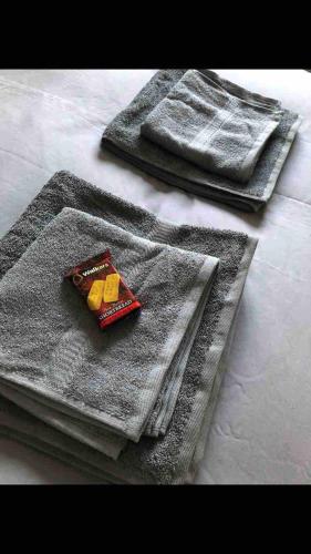 a gray towel with food on top of a table at Great for commuting, budget friendly apartment in Dalmuir