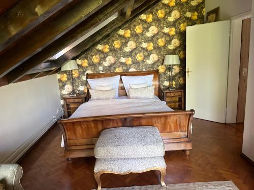 a bedroom with a wooden bed and a chair at Garden Apartment in Baden-Baden