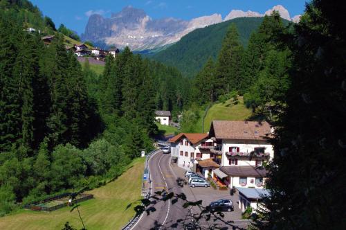 a winding road in a village in the mountains at Gasthof Löwen in Nova Levante