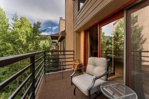 a balcony with a chair and a table at Snowdance Manor #405 : 2 in Keystone