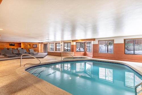 a large swimming pool in a hotel room at Snowdance Manor #405 : 2 in Keystone