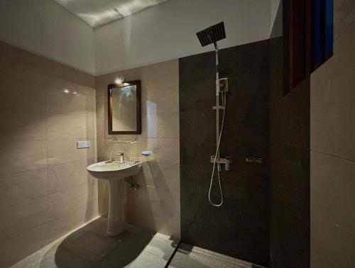 a bathroom with a sink and a shower at Hotel Dreamliners in Katunayaka