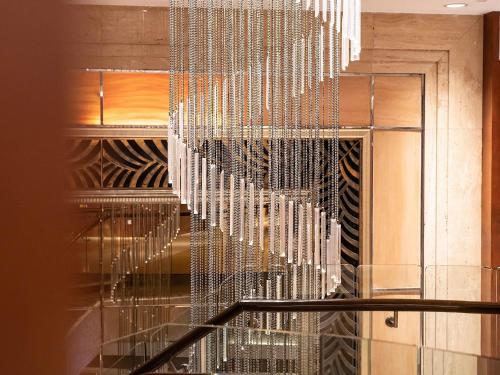 a glass staircase with a bunch of strings at Sofitel Nanjing Galaxy Suning in Nanjing