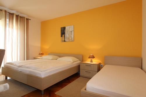 Ένα ή περισσότερα κρεβάτια σε δωμάτιο στο Villa Marica