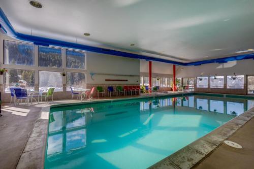a swimming pool with blue water in a building at Decatur #1797 in Keystone