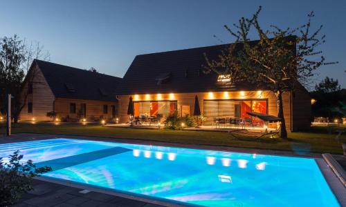 a house with a swimming pool in front of a house at Kauperhof in Burg