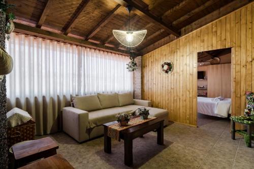 a living room with a couch and a table at Casas da Aldeia da Graça in Guimarães