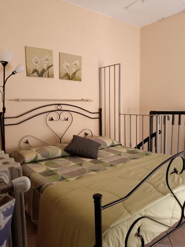 a bedroom with a large bed in a room at La casa di Pina in Latronico
