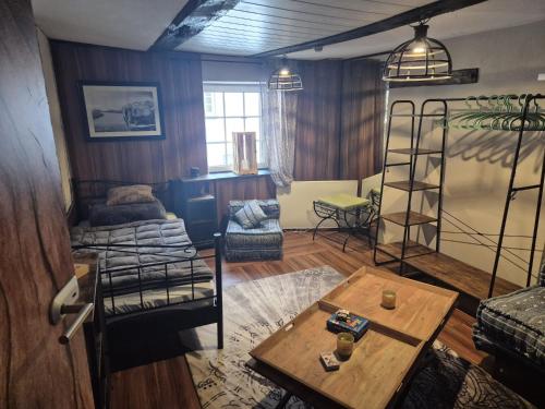 a living room with a bunk bed and a table at Ferienwohnung Meise in Sundern