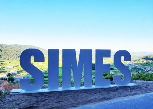 a large sign sitting on top of a hill at Lar do Cacheiro in Meaño