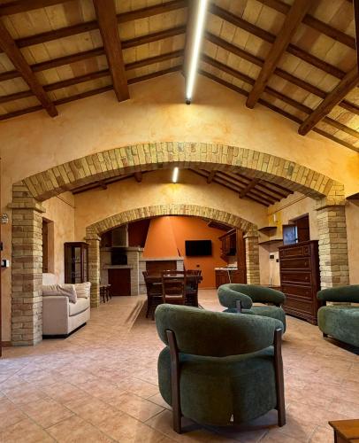 a large living room with an archway in a building at Villa Iulia - VIBRA in Controguerra