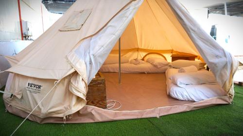 a tent with two beds inside of it at Camping San Javier in San Javier