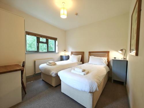 a bedroom with two beds and a window at 3 Bed in Lambourn oc-w42717 in Lambourn