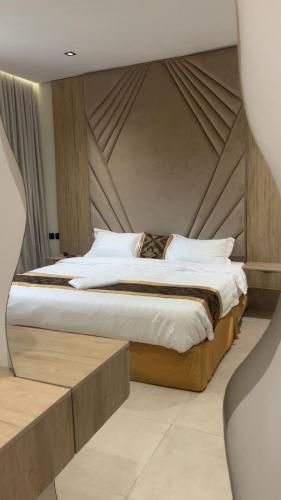 a bedroom with a large bed in a room at ايا ان AYA Inn in Jeddah