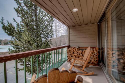a balcony with rocking chairs and a large window at Lenawee #1727 in Keystone