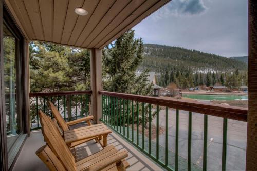 a porch with a chair and a view of a lake at Lenawee #1727 in Keystone