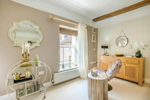 a room with a chair and a table and a window at 2 Bed in Blythburgh oc-w42765 in Blyford