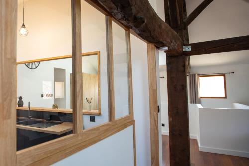 a bathroom with a mirror and a sink at L'écrin de St Antoine in Saint-Antoine