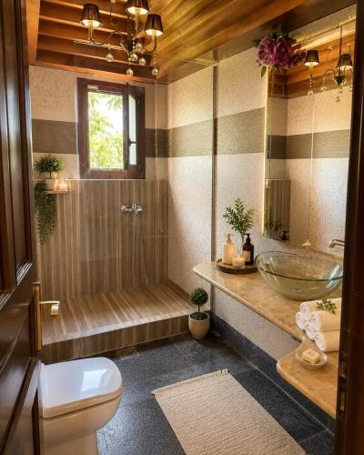 a bathroom with a tub and a sink and a toilet at Marsia House in Vathí