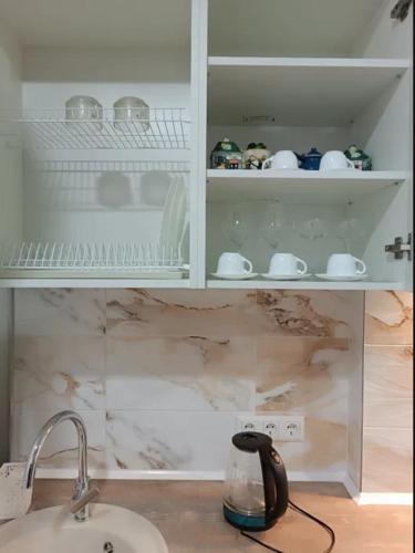 a kitchen counter with a sink and a cupboard at ЖК Акрополь, Парк Перемоги, Аркадія in Odesa