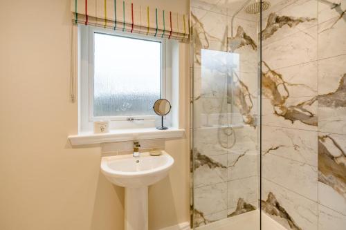 a bathroom with a toilet and a window and a shower at 2 Bed in Ochiltree oc-w37517 in Ochiltree