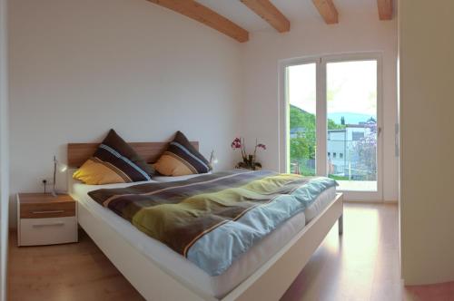 Säng eller sängar i ett rum på Weifnerhof