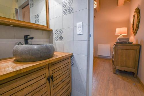 a bathroom with a sink on top of a counter at La ferm'hier in Balnot-sur-Laignes